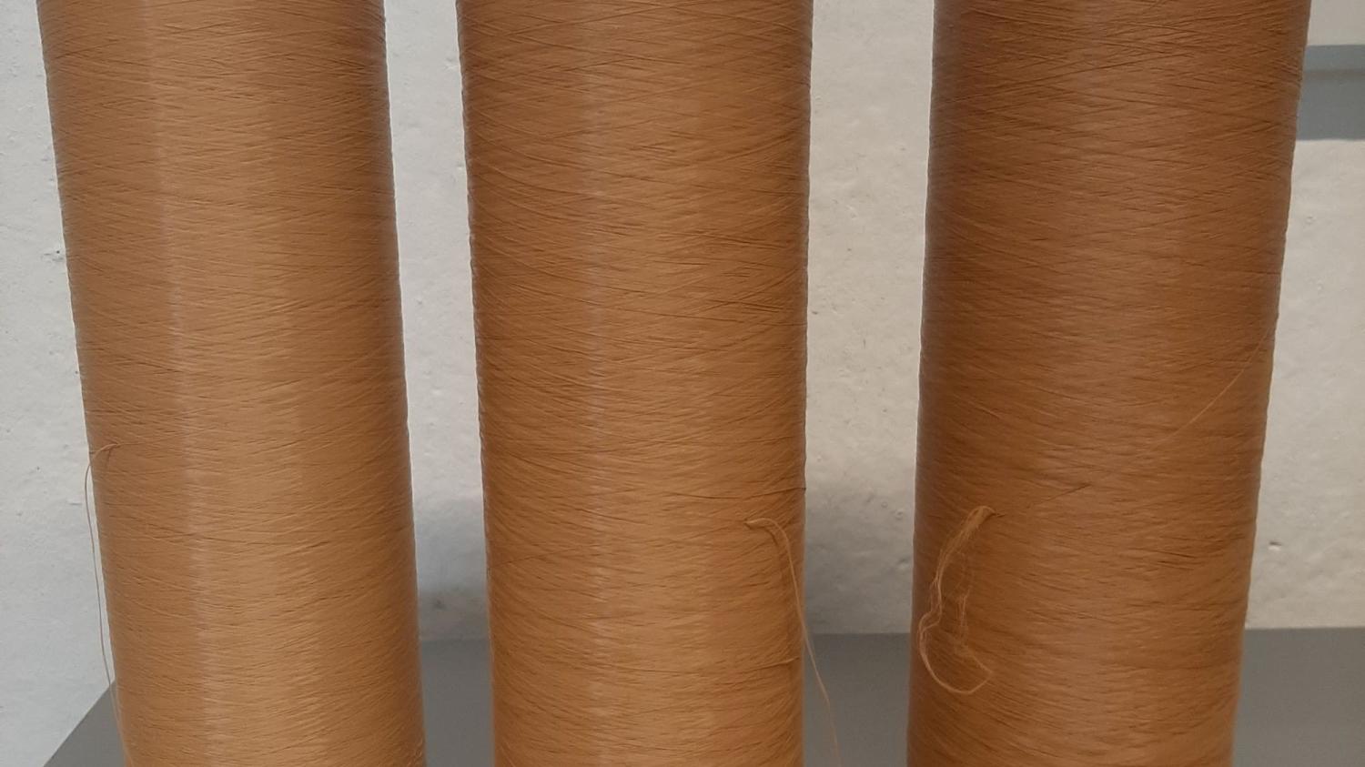 Biopolyester filament spools in various colours, copyright CENTEXBEL